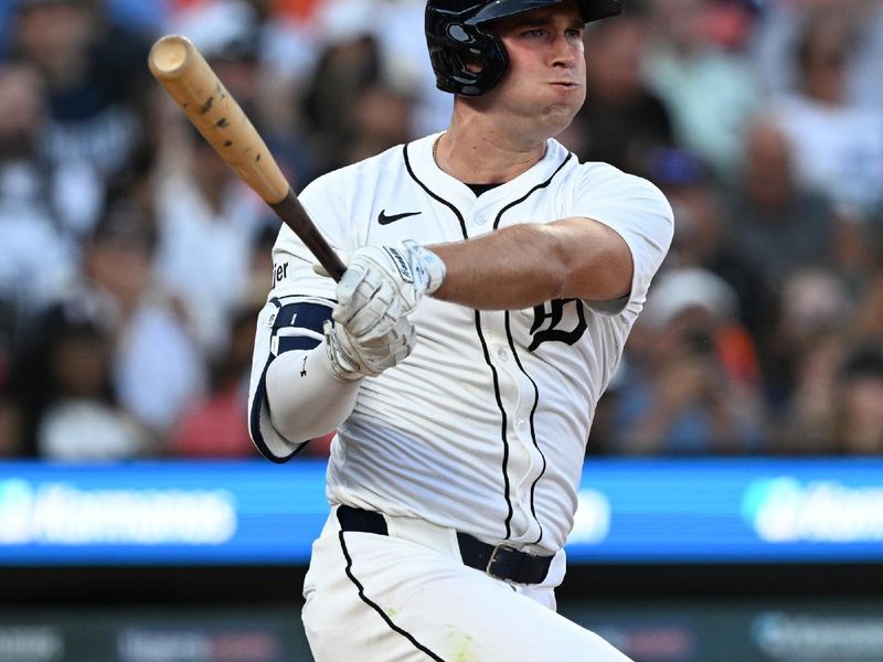 Jun 29, 2025; Detroit, Michigan, USA; Detroit Tigers right fielder Kerry Carpenter (30) hits an RBI triple against the Minnesota Twins in the fifth inning at Comerica Park. Mandatory Credit: Lon Horwedel-Imagn Images
