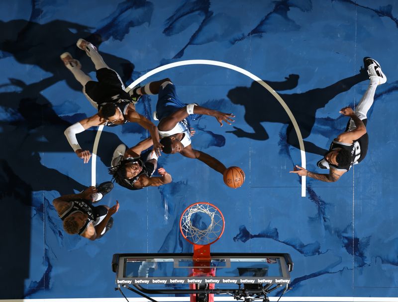 MINNEAPOLIS, MN -  FEBRUARY 27: Anthony Edwards #5 of the Minnesota Timberwolves drives to the basket during the game against the San Antonio Spurs on February 27, 2024 at Target Center in Minneapolis, Minnesota. NOTE TO USER: User expressly acknowledges and agrees that, by downloading and or using this Photograph, user is consenting to the terms and conditions of the Getty Images License Agreement. Mandatory Copyright Notice: Copyright 2024 NBAE (Photo by David Sherman/NBAE via Getty Images)