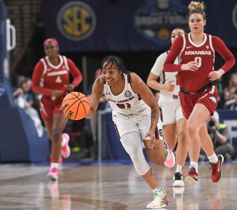 Mar 3, 2023; Greenville, SC, USA; South Carolina guard Kierra Fletcher (41) runs ahead of Arkansas guard Saylor Poffenbarger (0) during the first quarter at Bon Secours Wellness Arena. Mandatory Credit: Ken Ruinard-USA TODAY Sports