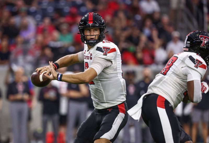 Sep 4, 2021; Houston, Texas, USA; Texas Tech Red Raiders quarterback Tyler Shough (12) attempts a pass during the first quarter against the Houston Cougars at NRG Stadium. Mandatory Credit: Troy Taormina-USA TODAY Sports