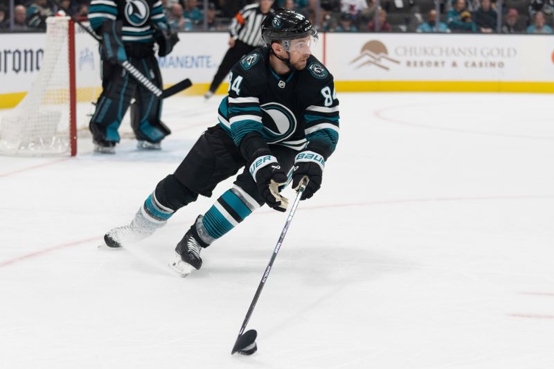 Feb 24, 2024; San Jose, California, USA; San Jose Sharks defenseman Jan Rutta (84) controls the puck during the first period against the Nashville Predators at SAP Center at San Jose. Mandatory Credit: Stan Szeto-USA TODAY Sports