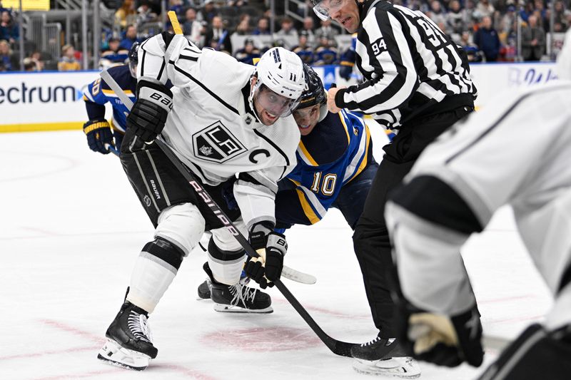 Jan 28, 2024; St. Louis, Missouri, USA; Los Angeles Kings center Anze Kopitar (11) and St. Louis Blues center Brayden Schenn (10) battle during the second period at Enterprise Center. Mandatory Credit: Jeff Le-USA TODAY Sports