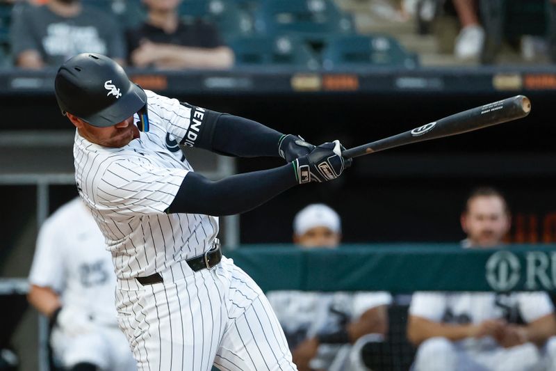 Jun 18, 2024; Chicago, Illinois, USA; Chicago White Sox third baseman Danny Mendick (0) hits a single against the Houston Astros during the third inning at Guaranteed Rate Field. Mandatory Credit: Kamil Krzaczynski-USA TODAY Sports