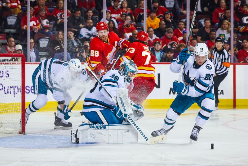 Apr 12, 2023; Calgary, Alberta, CAN; San Jose Sharks goaltender Kaapo Kahkonen (36) makes a save against the Calgary Flames during the second period at Scotiabank Saddledome. Mandatory Credit: Sergei Belski-USA TODAY Sports