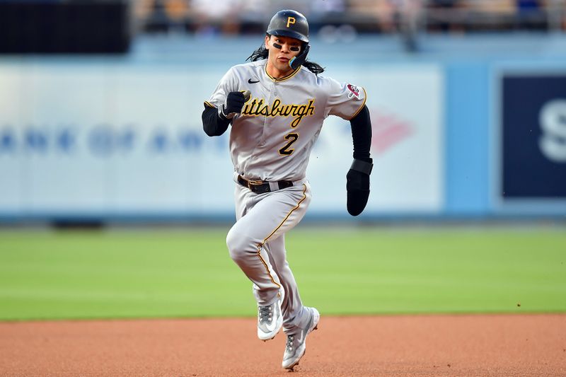 Jul 6, 2023; Los Angeles, California, USA; Pittsburgh Pirates right fielder Connor Joe (2) runs to third against the Los Angeles Dodgers during the second inning at Dodger Stadium. Mandatory Credit: Gary A. Vasquez-USA TODAY Sports