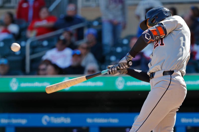 Apr 21, 2024; Minneapolis, Minnesota, USA; Detroit Tigers left fielder Mark Canha (21) hits a double against the Minnesota Twins in the ninth inning at Target Field. Mandatory Credit: Bruce Kluckhohn-USA TODAY Sports