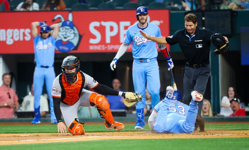 Jun 9, 2024; Arlington, Texas, USA; Texas Rangers right fielder Adolis García (53) steals home ahead of the tag by San Francisco Giants catcher Patrick Bailey (14) during the first inning at Globe Life Field. Mandatory Credit: Kevin Jairaj-USA TODAY Sports