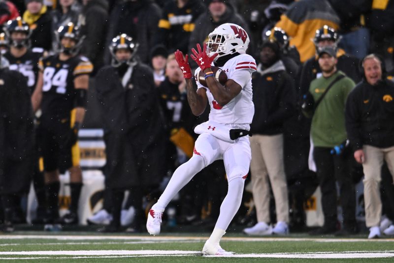 Nov 12, 2022; Iowa City, Iowa, USA; Wisconsin Badgers wide receiver Keontez Lewis (3) scores on a touchdown pass from quarterback Graham Mertz (not pictured) against the Iowa Hawkeyes during the second quarter at Kinnick Stadium. Mandatory Credit: Jeffrey Becker-USA TODAY Sports