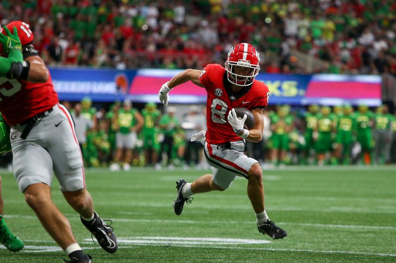 Sep 3, 2022; Atlanta, Georgia, USA; Georgia Bulldogs wide receiver Ladd McConkey (84) runs the ball for a touchdown against the Oregon Ducks in the first quarter at Mercedes-Benz Stadium. Mandatory Credit: Brett Davis-USA TODAY Sports
