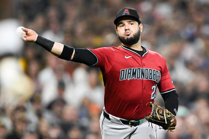 Jun 6, 2024; San Diego, California, USA; Arizona Diamondbacks third baseman Eugenio Suarez (28) throws San Diego Padres left fielder Jurickson Profar (10) out at first base during the fifth inning at Petco Park. Mandatory Credit: Denis Poroy-USA TODAY Sports at Petco Park.