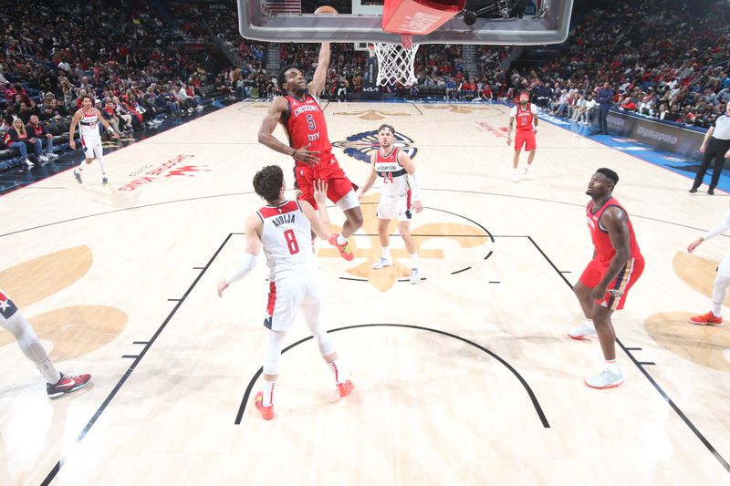 NEW ORLEANS, LA - FEBRUARY 14: Herb Jones #5 of the New Orleans Pelicans drives to the basket during the game against the Washington Wizards on February 14, 2024 at the Smoothie King Center in New Orleans, Louisiana. NOTE TO USER: User expressly acknowledges and agrees that, by downloading and or using this Photograph, user is consenting to the terms and conditions of the Getty Images License Agreement. Mandatory Copyright Notice: Copyright 2024 NBAE (Photo by Layne Murdoch Jr./NBAE via Getty Images)