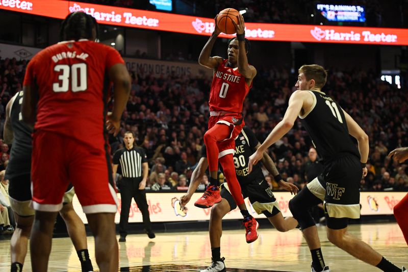 Jan 28, 2023; Winston-Salem, North Carolina, USA;  North Carolina State Wolfpack guard Terquavion Smith (0) shoots a runner between Wake Forest Demon Deacons guard Damari Monsanto (30) and forward Andrew Carr (11) during the second half at Lawrence Joel Veterans Memorial Coliseum. Mandatory Credit: William Howard-USA TODAY Sports