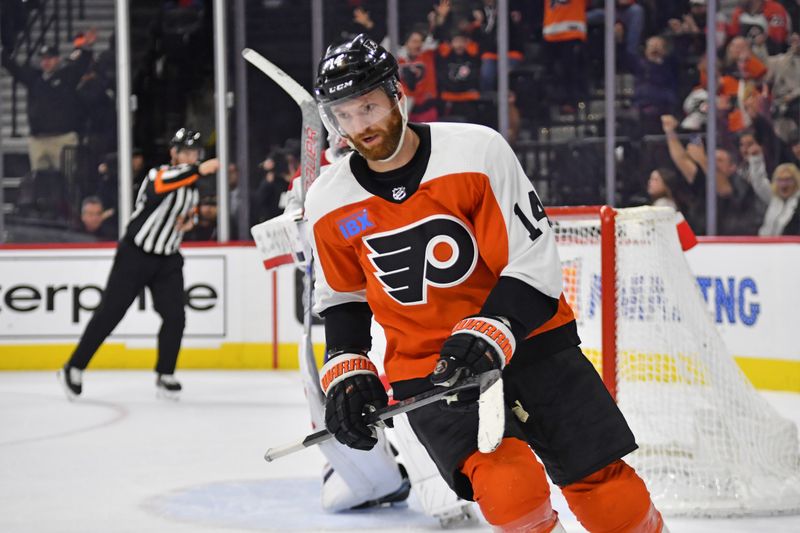 Jan 10, 2024; Philadelphia, Pennsylvania, USA; Philadelphia Flyers center Sean Couturier (14) celebrates his goal against the Montreal Canadiens during the shootout at Wells Fargo Center. Mandatory Credit: Eric Hartline-USA TODAY Sports