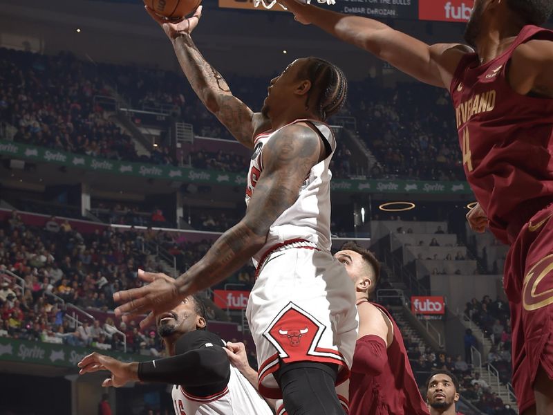 CLEVELAND, OH - FEBRUARY 14: DeMar DeRozan #11 of the Chicago Bulls shoots the ball during the game against the Cleveland Cavaliers on February 14, 2024 at Rocket Mortgage FieldHouse in Cleveland, Ohio. NOTE TO USER: User expressly acknowledges and agrees that, by downloading and/or using this Photograph, user is consenting to the terms and conditions of the Getty Images License Agreement. Mandatory Copyright Notice: Copyright 2024 NBAE (Photo by David Liam Kyle/NBAE via Getty Images)