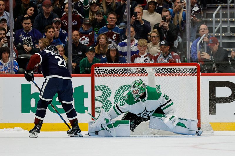 Oct 11, 2025; Denver, Colorado, USA; Dallas Stars goaltender Jake Oettinger (29) makes a shootout save against Colorado Avalanche center Nathan MacKinnon (29) to win the game at Ball Arena. Mandatory Credit: Isaiah J. Downing-Imagn Images