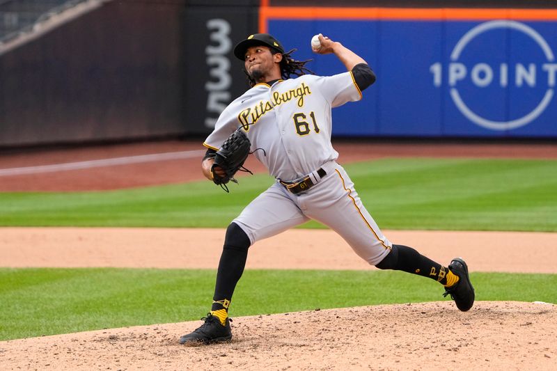 Aug 16, 2023; New York City, New York, USA; Pittsburgh Pirates pitcher Jose Hernandez (61) delivers a pitch against the New York Mets during the seventh inning at Citi Field. Mandatory Credit: Gregory Fisher-USA TODAY Sports