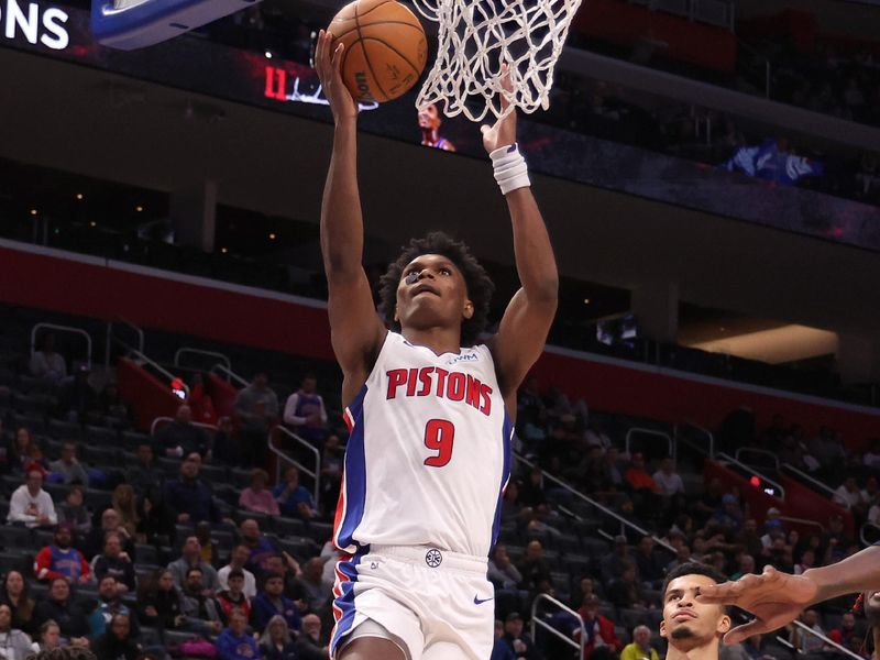 DETROIT, MICHIGAN - NOVEMBER 01: Ausar Thompson #9 of the Detroit Pistons drives to the basket past Toumani Camara #33 of the Portland Trail Blazers during the second half at Little Caesars Arena on November 01, 2023 in Detroit, Michigan. Portland won the game 110-101. NOTE TO USER: User expressly acknowledges and agrees that, by downloading and or using this photograph, User is consenting to the terms and conditions of the Getty Images License Agreement. (Photo by Gregory Shamus/Getty Images)