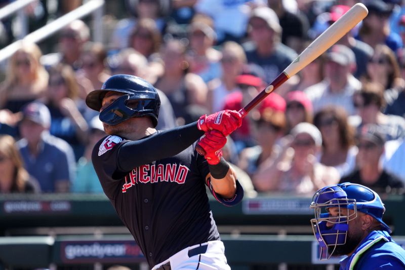 Mar 2, 2024; Goodyear, Arizona, USA; Cleveland Guardians third baseman Tyler Freeman (2) hits a home run against the Kansas City Royals during the first inning at Goodyear Ballpark. Mandatory Credit: Joe Camporeale-USA TODAY Sports