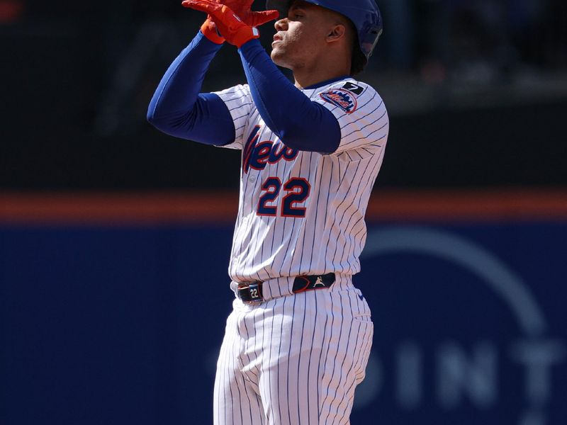 Apr 20, 2025; New York City, New York, USA; New York Mets right fielder Juan Soto (22) reacts after hitting a two-run double during the eighth inning against the St. Louis Cardinals at Citi Field. Mandatory Credit: Vincent Carchietta-Imagn Images
