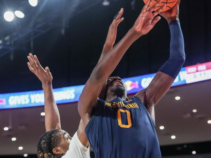 Jan 15, 2025; Houston, Texas, USA;  West Virginia Mountaineers center Eduardo Andre (0) shoots against Houston Cougars forward Ja'Vier Francis (5) in the first half at Fertitta Center. Mandatory Credit: Thomas Shea-Imagn Images