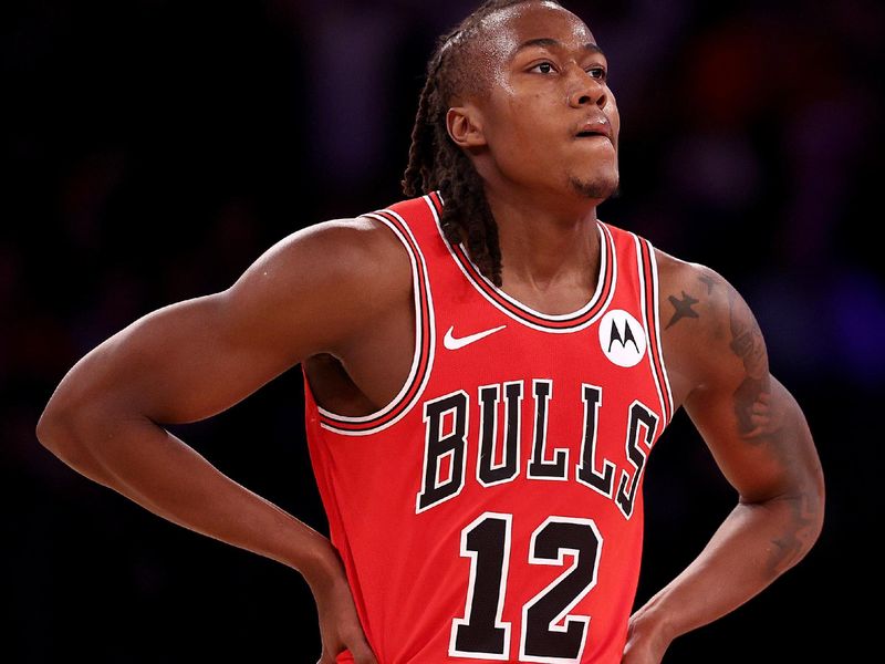 NEW YORK, NEW YORK - JANUARY 03: Ayo Dosunmu #12 of the Chicago Bulls reacts as he heads to the bench during the second half against the New York Knicks at Madison Square Garden on January 03, 2024 in New York City. The New York Knicks defeated the Chicago Bulls 116-100. NOTE TO USER: User expressly acknowledges and agrees that, by downloading and or using this photograph, User is consenting to the terms and conditions of the Getty Images License Agreement. (Photo by Elsa/Getty Images)