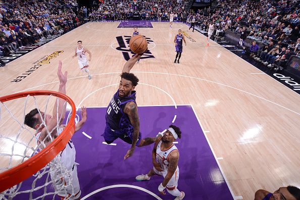 SACRAMENTO, CA - DECEMBER 22:  Malik Monk #0 of the Sacramento Kings goes to the basket during the game on December 22, 2023 at Golden 1 Center in Sacramento, California. NOTE TO USER: User expressly acknowledges and agrees that, by downloading and or using this Photograph, user is consenting to the terms and conditions of the Getty Images License Agreement. Mandatory Copyright Notice: Copyright 2023 NBAE (Photo by Rocky Widner/NBAE via Getty Images)