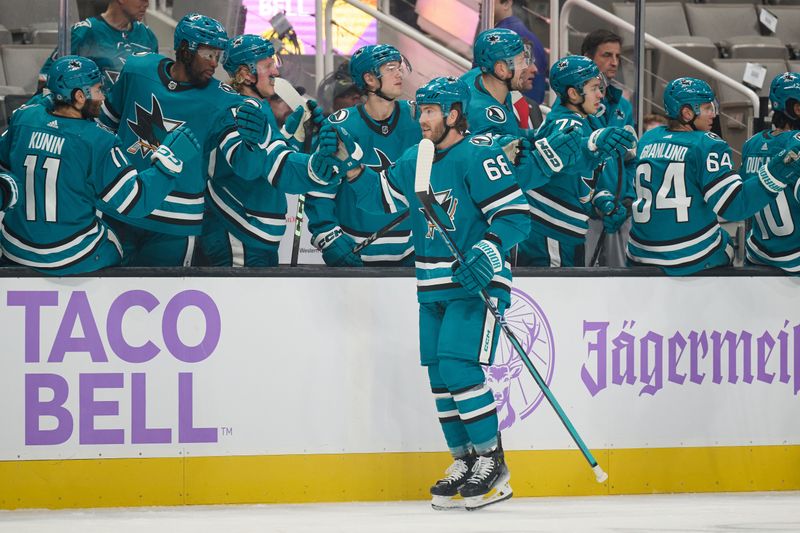 Nov 16, 2023; San Jose, California, USA; San Jose Sharks left wing Mike Hoffman (68) shakes hands with his teammates on the bench after scoring a goal against the St. Louis Blues during the first period at SAP Center at San Jose. Mandatory Credit: Robert Edwards-USA TODAY Sports