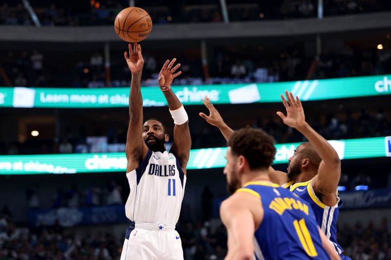 DALLAS, TEXAS - MARCH 13: Kyrie Irving #11 of the Dallas Mavericks shoots the ball against the Golden State Warriors in the first half at American Airlines Center on March 13, 2024 in Dallas, Texas. NOTE TO USER: User expressly acknowledges and agrees that, by downloading and or using this photograph, User is consenting to the terms and conditions of the Getty Images License Agreement. (Photo by Tim Heitman/Getty Images)