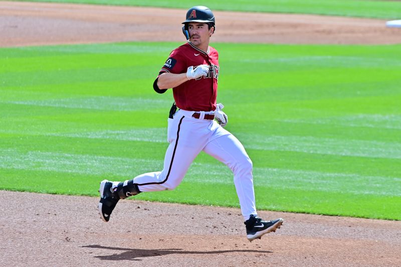 Mar 14, 2023; Salt River Pima-Maricopa, Arizona, USA; Arizona Diamondbacks left fielder Corbin Carroll (7) hits a triple in the first inning against the San Francisco Giants during a Spring Training game at Salt River Fields at Talking Stick. Mandatory Credit: Matt Kartozian-USA TODAY Sports