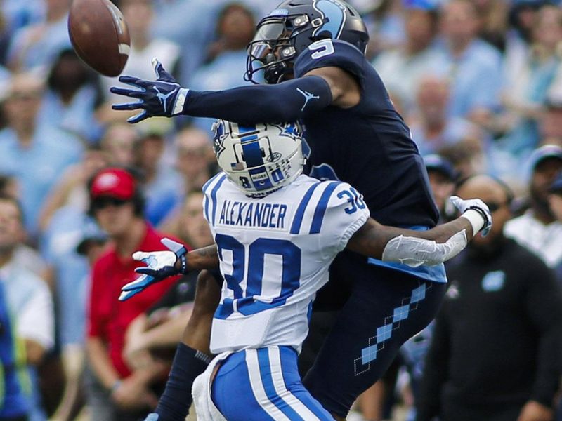 Oct 26, 2019; Chapel Hill, NC, USA; North Carolina Tar Heels wide receiver Dazz Newsome (right) catches a pass against Duke Blue Devils safety Jalen Alexander (30) in the first half of a college football game at Kenan Memorial Stadium. Mandatory Credit: Nell Redmond-USA TODAY Sports