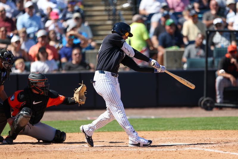 Mar 11, 2025; Tampa, Florida, USA; New York Yankees outfielder Cody Bellinger (35) doubles against the Baltimore Orioles in the sixth inning during spring training at George M. Steinbrenner Field. Mandatory Credit: Nathan Ray Seebeck-Imagn Images