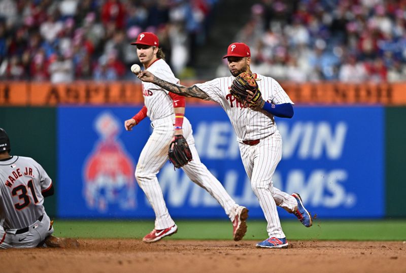 May 5, 2024; Philadelphia, Pennsylvania, USA; Philadelphia Phillies infielder Edmundo Sosa (33) turns a double play against the San Francisco Giants in the sixth inning at Citizens Bank Park. Mandatory Credit: Kyle Ross-USA TODAY Sports