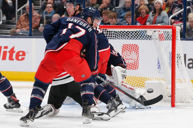 Nov 22, 2023; Columbus, Ohio, USA; Columbus Blue Jackets right wing Justin Danforth (17) clears a rebound of a Chicago Blackhawks shot during the second period at Nationwide Arena. Mandatory Credit: Russell LaBounty-USA TODAY Sports