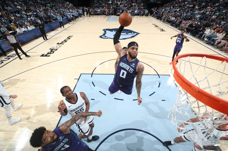 MEMPHIS, TN - MARCH 13: Miles Bridges #0 of the Charlotte Hornets dunks the ball during the game against the Memphis Grizzlies on March 13, 2024 at FedExForum in Memphis, Tennessee. NOTE TO USER: User expressly acknowledges and agrees that, by downloading and or using this photograph, User is consenting to the terms and conditions of the Getty Images License Agreement. Mandatory Copyright Notice: Copyright 2024 NBAE (Photo by Joe Murphy/NBAE via Getty Images)