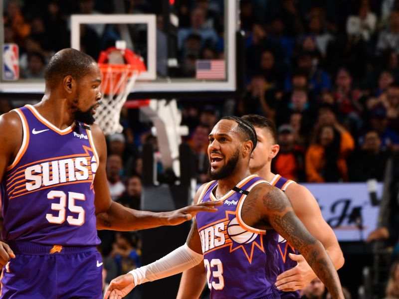 PHOENIX, AZ - NOVEMBER 30: Monte Morris #23 of the Phoenix Suns celebrates during the game against the Golden State Warriors on November 30, 2024 at Footprint Center in Phoenix, Arizona. NOTE TO USER: User expressly acknowledges and agrees that, by downloading and or using this photograph, user is consenting to the terms and conditions of the Getty Images License Agreement. Mandatory Copyright Notice: Copyright 2024 NBAE (Photo by Barry Gossage/NBAE via Getty Images)