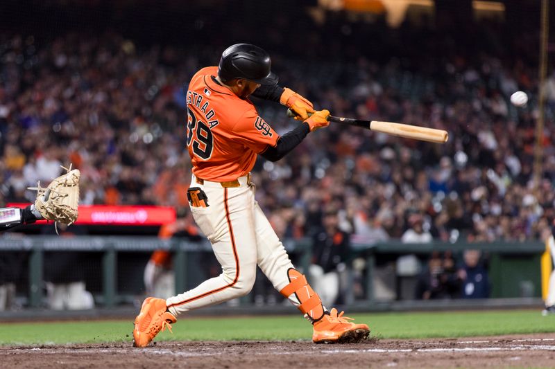 May 17, 2024; San Francisco, California, USA; San Francisco Giants second baseman Thairo Estrada (39) hits a three-run home run against the Colorado Rockies during the fifth inning at Oracle Park. Mandatory Credit: John Hefti-USA TODAY Sports