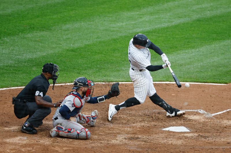 Jun 8, 2024; Chicago, Illinois, USA; Chicago White Sox first baseman Andrew Vaughn (25) hits an RBI-single against the Boston Red Sox during the fifth inning at Guaranteed Rate Field. Mandatory Credit: Kamil Krzaczynski-USA TODAY Sports