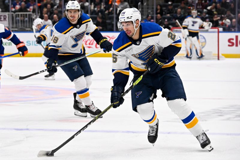 Mar 5, 2024; Elmont, New York, USA;  St. Louis Blues center Jordan Kyrou (25) skates across the blue line against the New York Islanders during the first period at UBS Arena. Mandatory Credit: Dennis Schneidler-USA TODAY Sports