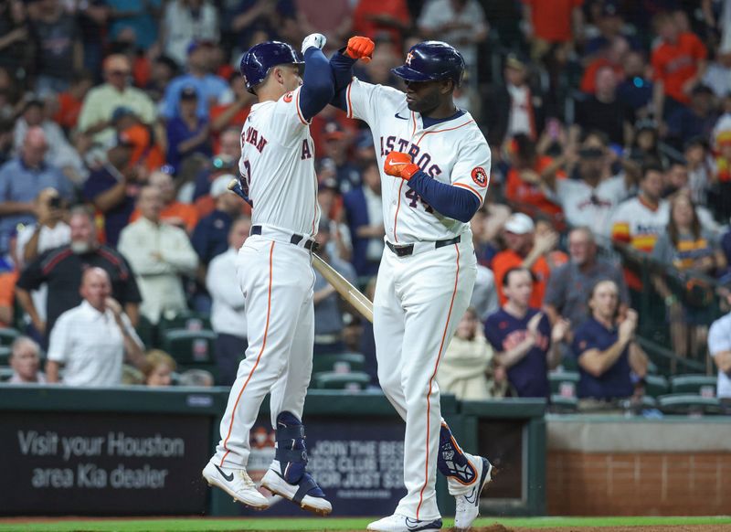 Apr 3, 2024; Houston, Texas, USA; Houston Astros left fielder Yordan Alvarez (44) celebrates with third baseman Alex Bregman (2) after hitting a home run during the third inning against the Toronto Blue Jays at Minute Maid Park. Mandatory Credit: Troy Taormina-USA TODAY Sports