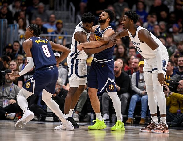 DENVER, CO - DECEMBER 28: Jaren Jackson Jr. (13) and Vince Williams Jr. (5) of the Memphis Grizzlies guard Jamal Murray (27) of the Denver Nuggets on an inbound pass during the first quarter at Ball Arena in Denver on Thursday, December 28, 2023. (Photo by AAron Ontiveroz/The Denver Post)