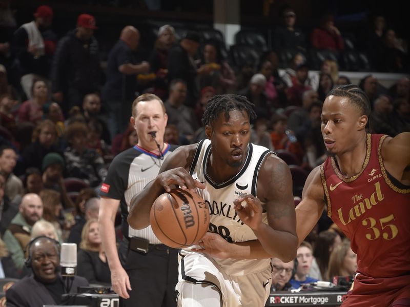 CLEVELAND, OH - MARCH 10: Dorian Finney-Smith #28 of the Brooklyn Nets dribbles the ball during the game against the Cleveland Cavaliers on March 10, 2024 at Rocket Mortgage FieldHouse in Cleveland, Ohio. NOTE TO USER: User expressly acknowledges and agrees that, by downloading and/or using this Photograph, user is consenting to the terms and conditions of the Getty Images License Agreement. Mandatory Copyright Notice: Copyright 2024 NBAE (Photo by David Liam Kyle/NBAE via Getty Images)