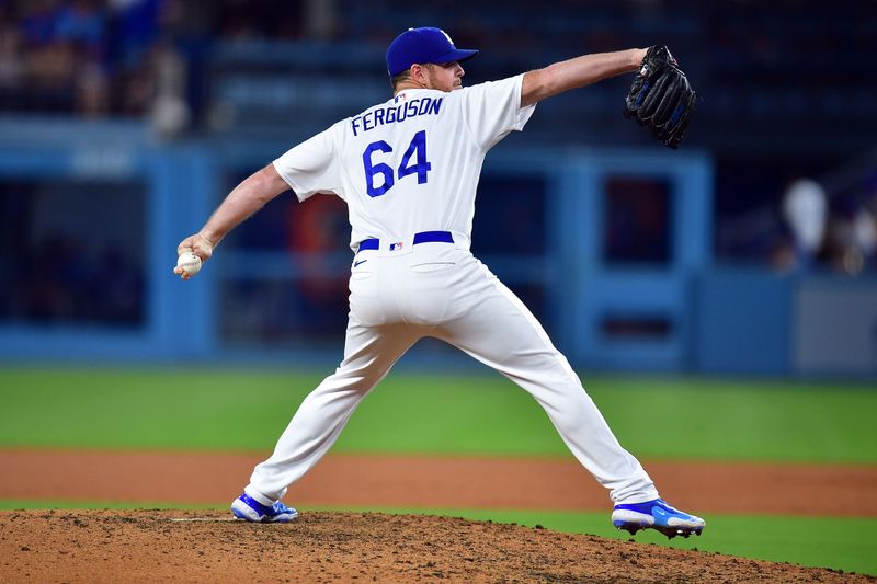 Jul 24, 2023; Los Angeles, California, USA; Los Angeles Dodgers relief pitcher Caleb Ferguson (64) throws against the Toronto Blue Jays during the sixth inning at Dodger Stadium. Mandatory Credit: Gary A. Vasquez-USA TODAY Sports