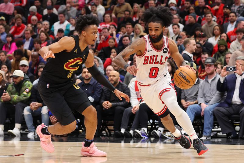 CHICAGO, ILLINOIS - FEBRUARY 28: Coby White #0 of the Chicago Bulls drives to the basket against Isaac Okoro #35 of the Cleveland Cavaliers during the second half at the United Center on February 28, 2024 in Chicago, Illinois. NOTE TO USER: User expressly acknowledges and agrees that, by downloading and or using this photograph, User is consenting to the terms and conditions of the Getty Images License Agreement. (Photo by Michael Reaves/Getty Images)