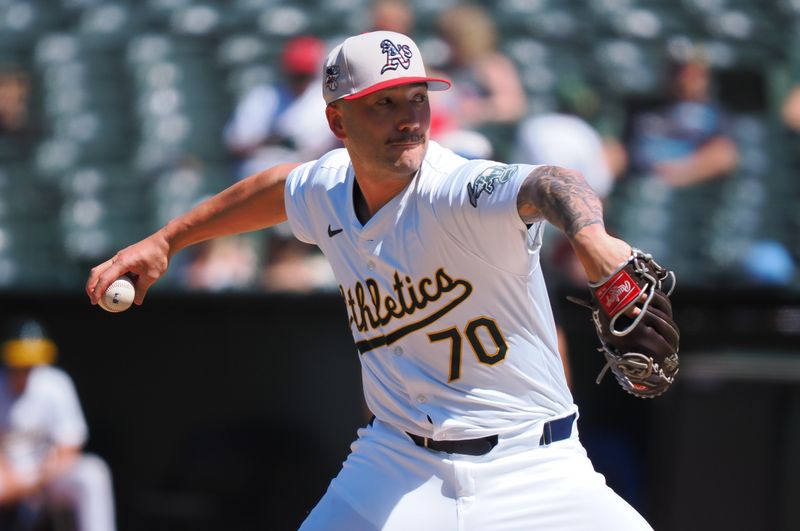 Jul 4, 2024; Oakland, California, USA; Oakland Athletics relief pitcher Lucas Erceg (70) pitches the ball against the Los Angeles Angels during the eighth inning at Oakland-Alameda County Coliseum. Mandatory Credit: Kelley L Cox-USA TODAY Sports