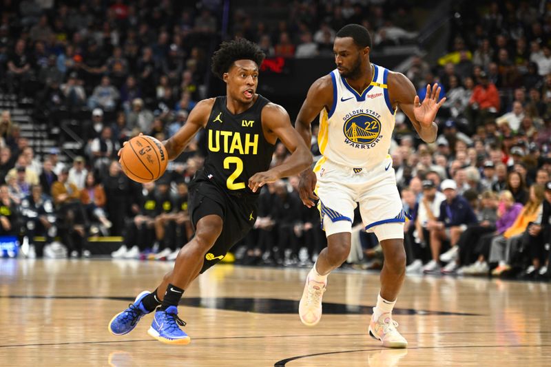 SALT LAKE CITY, UTAH - OCTOBER 25: Collin Sexton #2 of the Utah Jazz drives past Andrew Wiggins #22 of the Golden State Warriors during the first half of a game at Delta Center on October 25, 2024 in Salt Lake City, Utah. NOTE TO USER: User expressly acknowledges and agrees that, by downloading and or using this photograph, User is consenting to the terms and conditions of the Getty Images License Agreement. (Photo by Alex Goodlett/Getty Images)