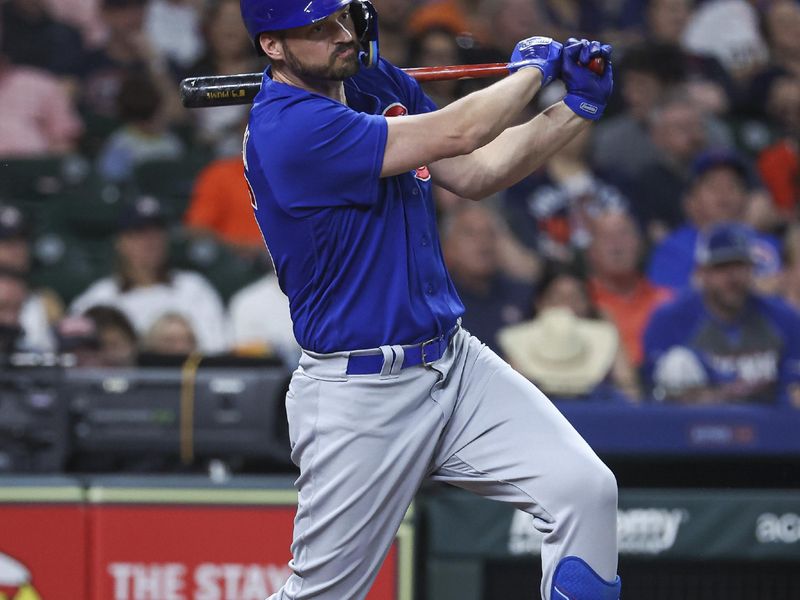 May 17, 2023; Houston, Texas, USA; Chicago Cubs designated hitter Trey Mancini (36) hits a single during the third inning against the Houston Astros at Minute Maid Park. Mandatory Credit: Troy Taormina-USA TODAY Sports