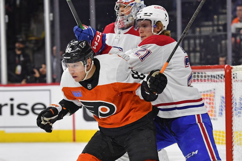 Jan 10, 2024; Philadelphia, Pennsylvania, USA; Philadelphia Flyers right wing Cam Atkinson (89) battles for position with Montreal Canadiens defenseman Kaiden Guhle (21) during third period at Wells Fargo Center. Mandatory Credit: Eric Hartline-USA TODAY Sports