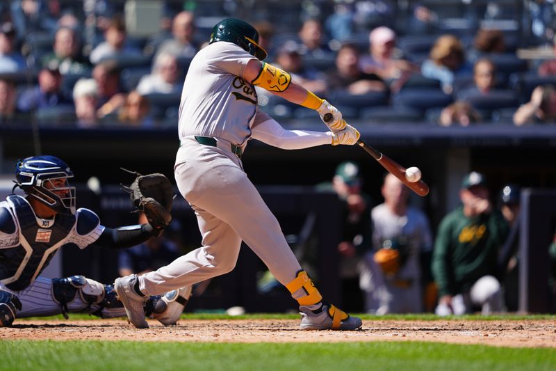 Apr 22, 2024; Bronx, New York, USA; Oakland Athletics left fielder Seth Brown (15) hits a single against the New York Yankees during the eighth inning at Yankee Stadium. Mandatory Credit: Gregory Fisher-USA TODAY Sports