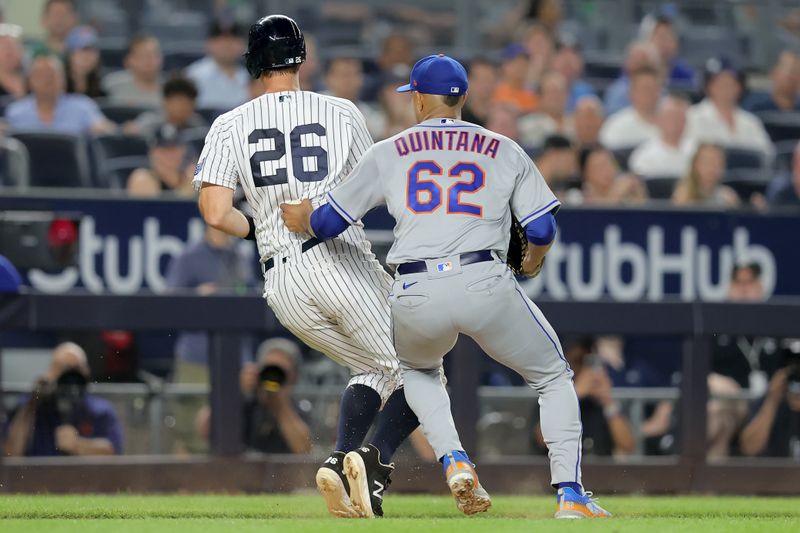 Jul 26, 2023; Bronx, New York, USA; New York Mets starting pitcher Jose Quintana (62) tags out New York Yankees third baseman DJ LeMahieu (26) in a rundown during the sixth inning at Yankee Stadium. Mandatory Credit: Brad Penner-USA TODAY Sports