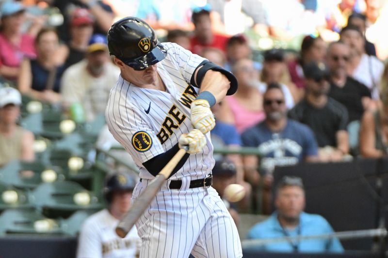 Sep 3, 2023; Milwaukee, Wisconsin, USA;  Milwaukee Brewers left fielder Mark Canha (21) hits a solo home run in the third inning against the Philadelphia Phillies at American Family Field. Mandatory Credit: Benny Sieu-USA TODAY Sports